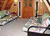 Upstairs bedroom with two Double Futons and door to private deck.
