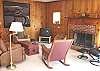 Downstairs Living Room with TV/VCR/DVD. and wood burning fireplace.