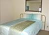 Lower level -  Bedroom with a Queen bed with spectacular ocean views and a door to the deck.