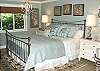 Master Bedroom with a King Bed.  Features flat screen TV/DVD and its own private bathroom with a garden tub and walk in closet.