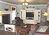 Family room with flat screen TV/DVD, CD stereo, Hide-a-bed for additional sleeping and Gas Fireplace.