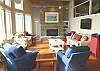 Living room with gas fireplace, TV/DVD/VCR and spectacular ocean front views.