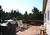 Second view - South facing deck with gas BBQ and lots of patio furniture.