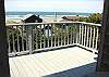 Second view - Upper level deck off living room with spectacular ocean views and a table with deck chairs.