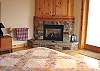 Second view - Lower level - Master Bedroom with a Queen, gas fireplace, door to deck and spectacular ocean views.  Private bathroom with Jacuzzi tub and large glass shower.