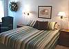 Lower level - Bedroom with a Queen bed and Twin bed, TV/VCR and peak ocean views.
