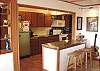 Third view - Fully equipped kitchen with breakfast table for 6 and a breakfast bar for 2.