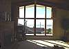 Upper level - Living room with large picture windows with spectacular ocean views.