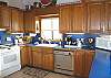 Upper level - Fully equipped kitchen with ocean views.