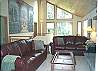 Third view - Upper level -  Living room with TV/DVD and wood burning fireplace.  Slider to back deck.