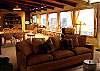 Second view - Upper level - Living room with TV/DVD, wood burning fireplace, ocean views and a slider out to the deck.  Dining table for 8.