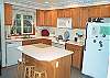 Lower level - Fully equipped kitchen with breakfast bar for 3.