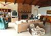 Upper level - Living room with TV/DVD, wood burning fireplace, ocean views and a slider out to the deck.