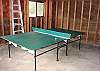 Garage with ping pong table.