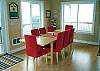 Upper level - Dining table for 8 and ocean views.  Slider out to upper wrap around deck.