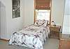 Upper level bedroom with a Twin bed and Two Twin Bunk beds.