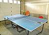 Garage with ping pong table.