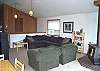 Upper level - Living room with TV/DVD, glass from wood stove and beautiful ocean views.