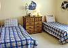 Middle/Entry level - Bedroom with two Twin beds.