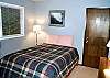 Bedroom with Queen bed and door to Sun Room (additional sleeping area)