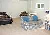 Second view - Lower Level - Large Family room with two couches and two day/trundle beds.