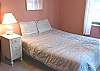 Downstairs bedroom with Queen bed and Twin bunk bed.
