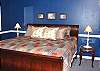 Upstairs - Master Bedroom with a King bed, slider to Hot Tub.