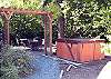 North facing patio with hot tub and outdoor furniture