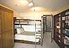 Downstairs bedroom with Queen Murphy bed and Twin Bunk bed, slider to sun room