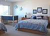 Upper level - Bedroom with a Queen bed and Twin bed, ocean views and a foos ball table.