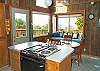 Upper level - Dining table for 4 with a bench seat, ocean views.