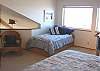 Second View - Upper level - Bedroom with a Queen bed and Twin bed, ocean views and a foos ball table.