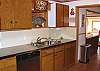 Second view - Fully equipped kitchen with breakfast table for 6 and a breakfast bar for 2.