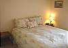 Middle/Entry level - Bedroom with a Queen bed.