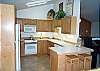 Upper level - Fully equipped kitchen with skylights and a breakfast bar for 2 with ocean views.