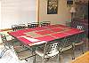 Upstairs Dining table for 10.  Slider out to front deck.
