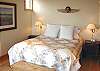 Lower level - Master Bedroom with a Queen, gas fireplace, door to deck and spectacular ocean views.  Private bathroom with Jacuzzi tub and large glass shower.