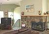 Beautiful double sided fireplace that can be viewed from the living room and the kitchen/dining room.