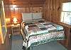 Upper level bedroom with a Double bed.