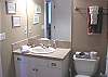 Hall bath with tub and shower.
