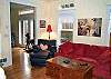 Third view of Living room with TV/VCR and double sided fireplace