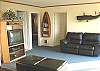 Living room with TV/VCR/DVD, gas fireplace and futon for additional sleeping.