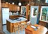 Upper level - Fully equipped kitchen with breakfast bar for 4 and ocean views.