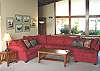 Upper level - Living room with large sectional, TV/VCR/DVD, wood stove insert, large picture windows with spectacular ocean views.