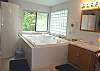 Upper level - Master bathroom with Jacuzzi tub and large shower.