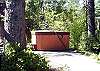 Second view - Large semi private back patio with hot tub and pation furniture.