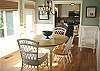 Dining table for 6 with a door to the side patio.