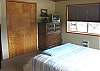 Second View of Master Bedroom with Queen bed and TV.