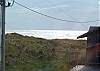 View of ocean front upper level, inside the house and from the deck. Beach access is just across the gravel road.