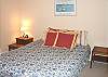 Middle/Entry level - Bedroom with a Queen bed.